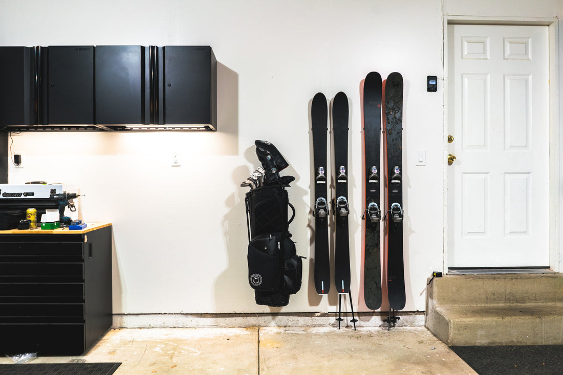 Sleek Black and Red Skis on Pristine White Wall: Modern Storage Elegance