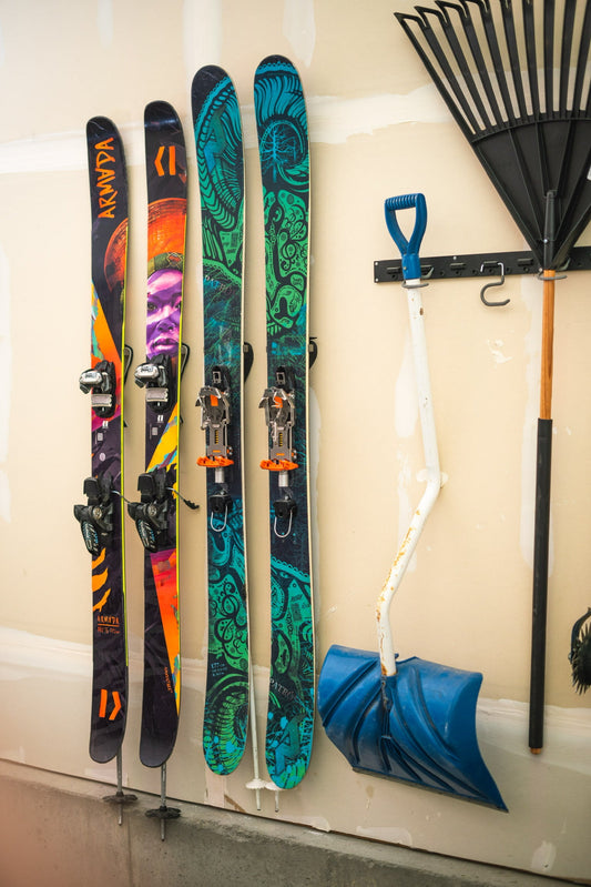 Vibrant Armada Skis on Neutral Wall: A Bold Storage Statement