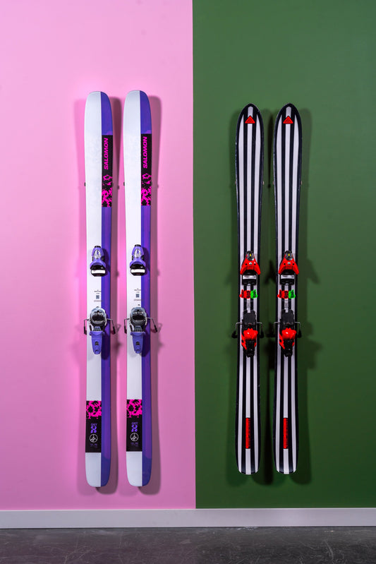 Bold Striped Skis on Pink and Green Walls: A Modern Display
