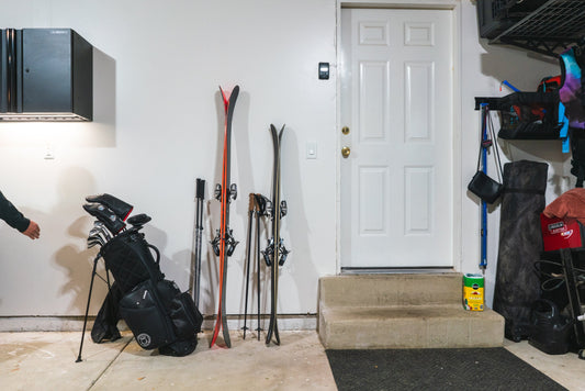 Sleek Red and Black Skis in Modern Garage: Hover's Elegant Storage Solution