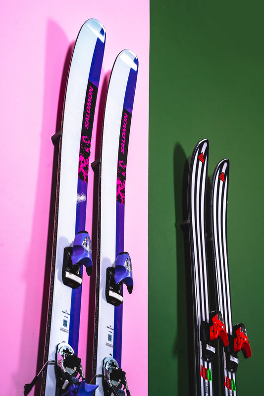 Vibrant Salomon Skis on Pink and Green Backdrop: A Modern Display
